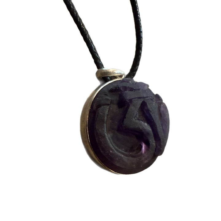 Hand Carved Om in Amethyst